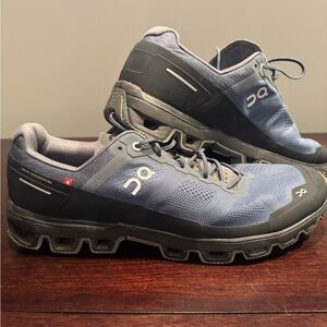 On CloudVenture Trail. Size men’s 14. Black and dark blue.
